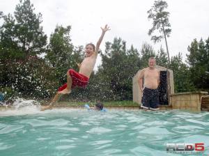 Jacob jumping (belly flop) into the pool